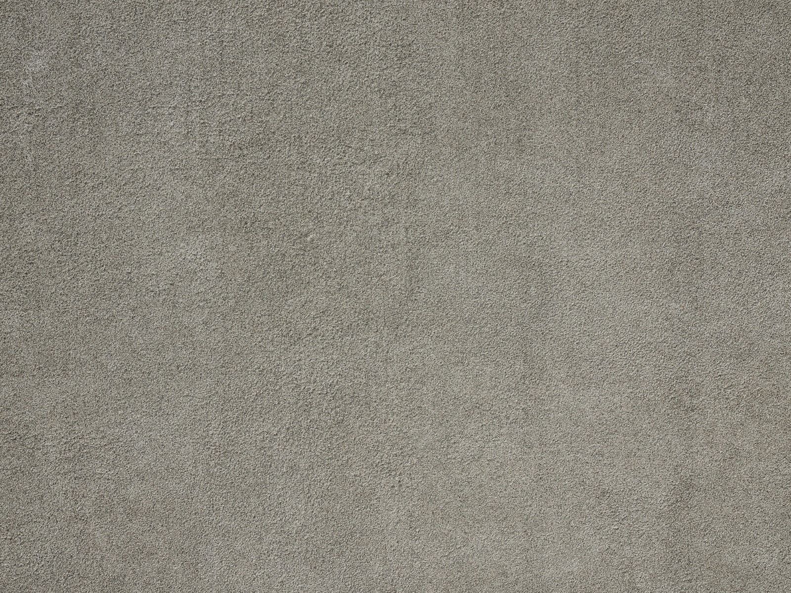 Betonmauer mit feinen Steinen