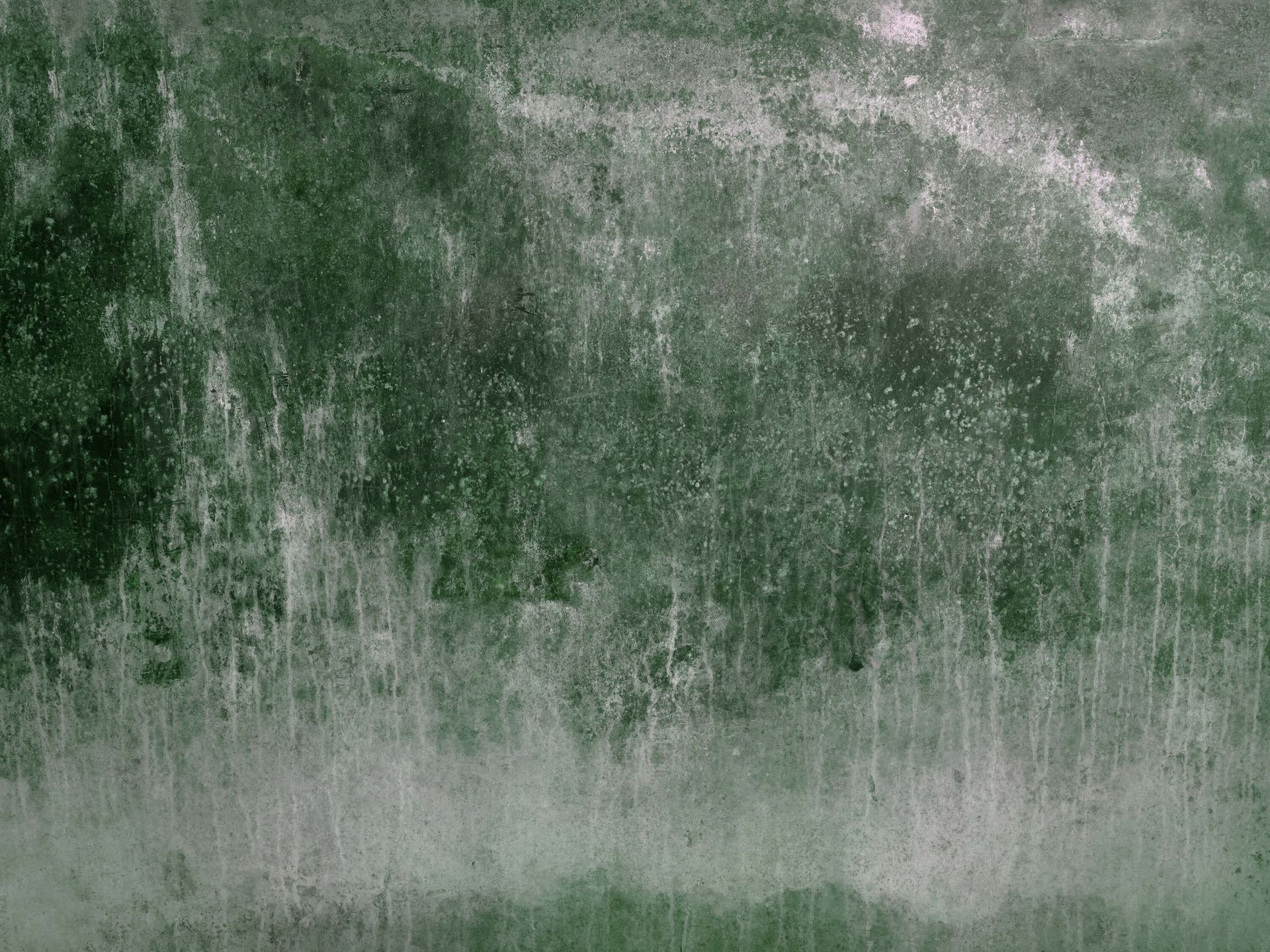 Alte verwitterte grüne Wand